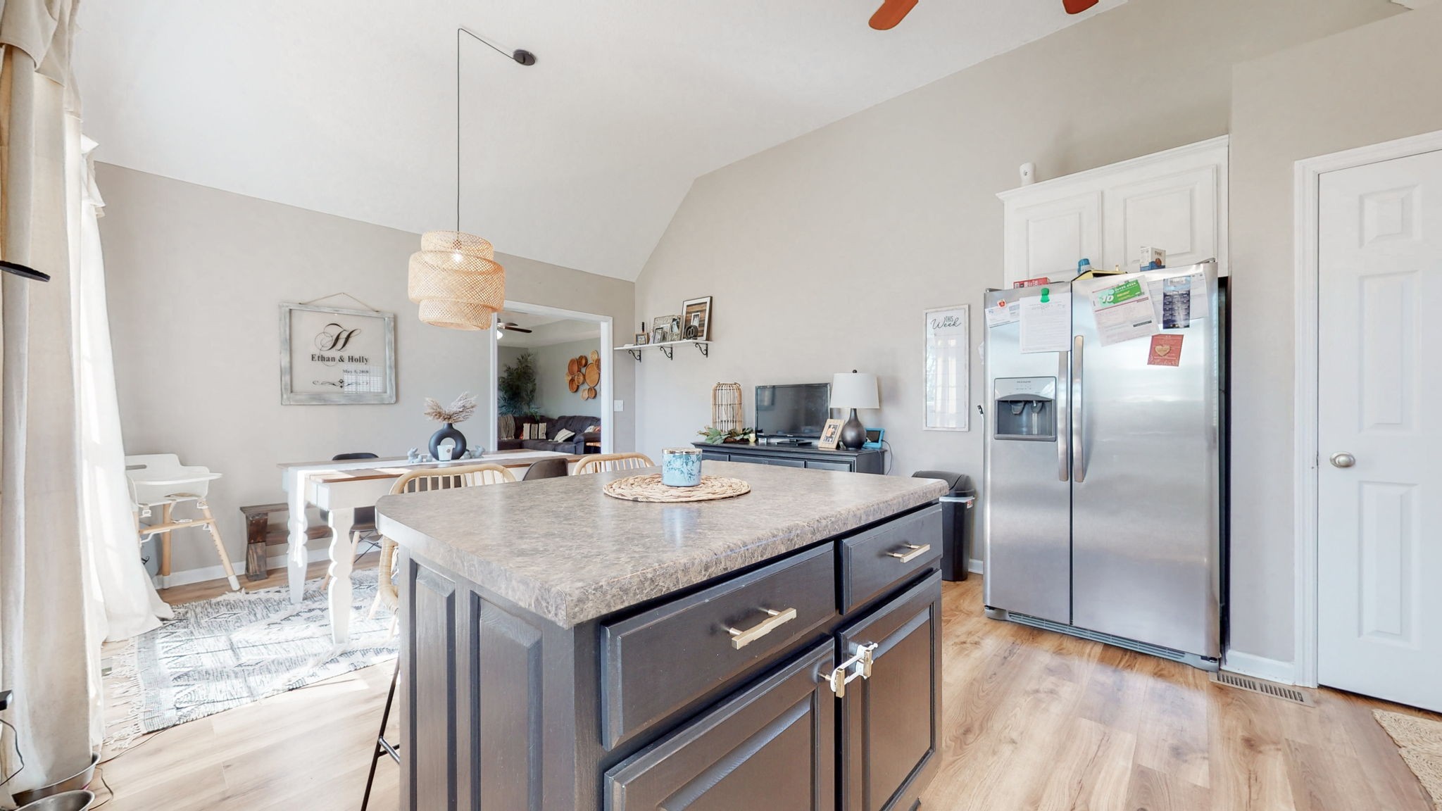 113 Wells Lee Road Elora, TN 37328 - Photo 12 of 39 a kitchen with stainless steel appliances granite countertop a sink a refrigerator and a view of living room