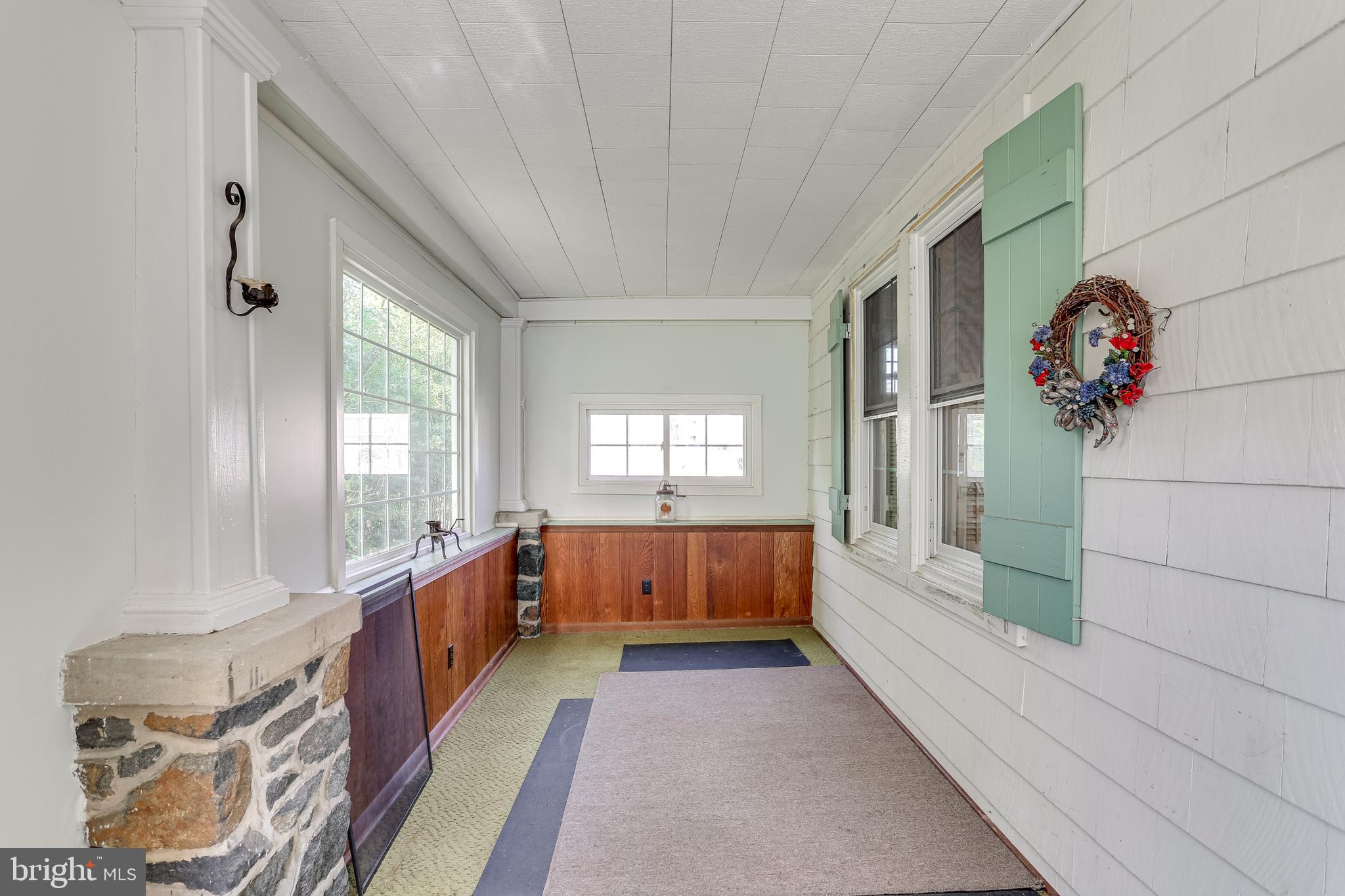 6828 Windsor Mill Road Baltimore, MD 21207 - Photo 16 of 43 Sunroom from front of home