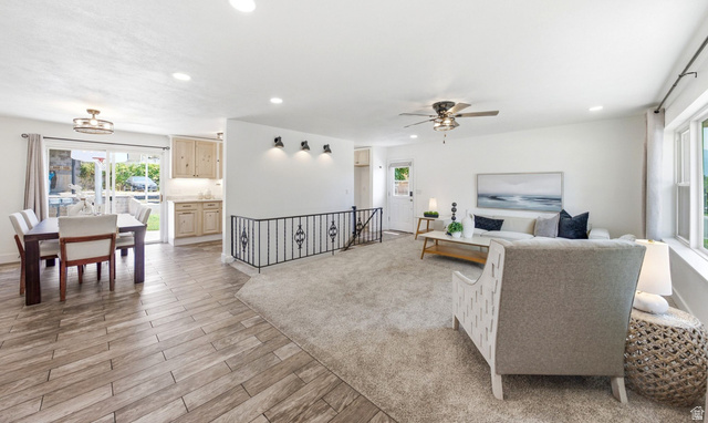 120 North 1230 E Street Springville, UT 84663 - Photo 5 of 60 Open-concept living area featuring a carpeted lounge with ceiling fan and abundant natural light