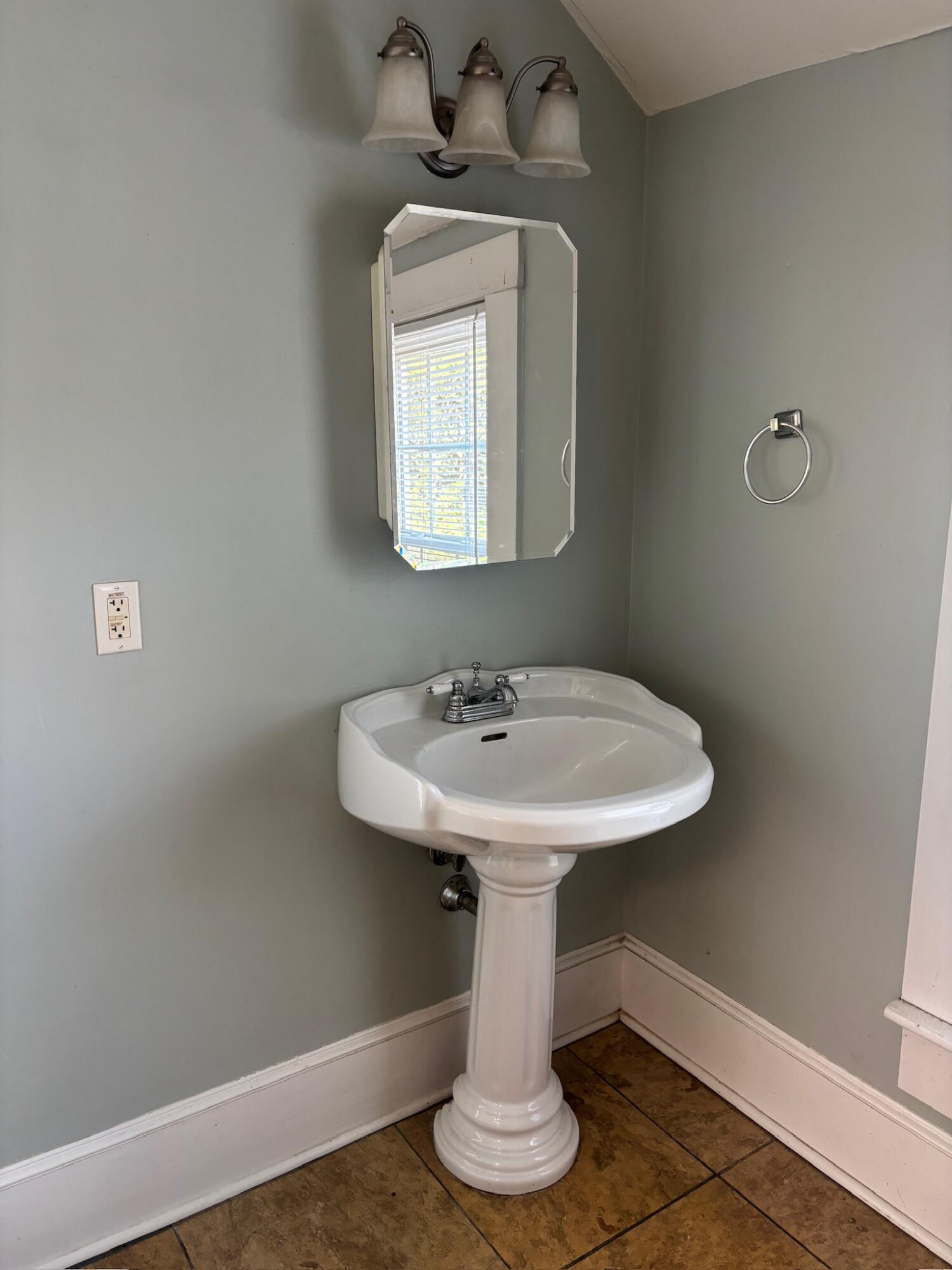 3045 Mountain Pass Road Troutville, VA 24175 - Photo 11 of 19 a bathroom with a sink a mirror and vanity