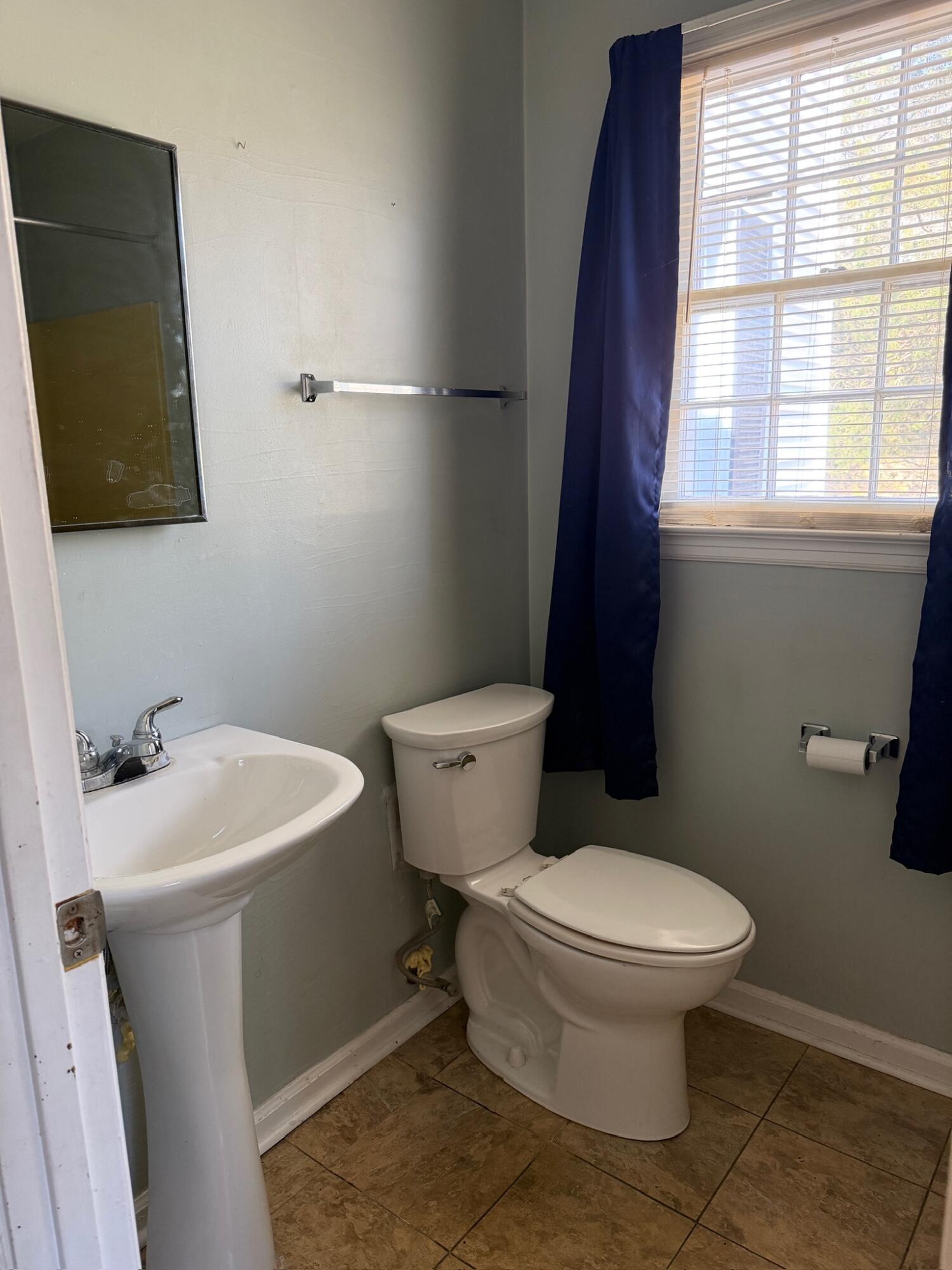 3045 Mountain Pass Road Troutville, VA 24175 - Photo 14 of 19 a white toilet sitting next to a bathroom sink