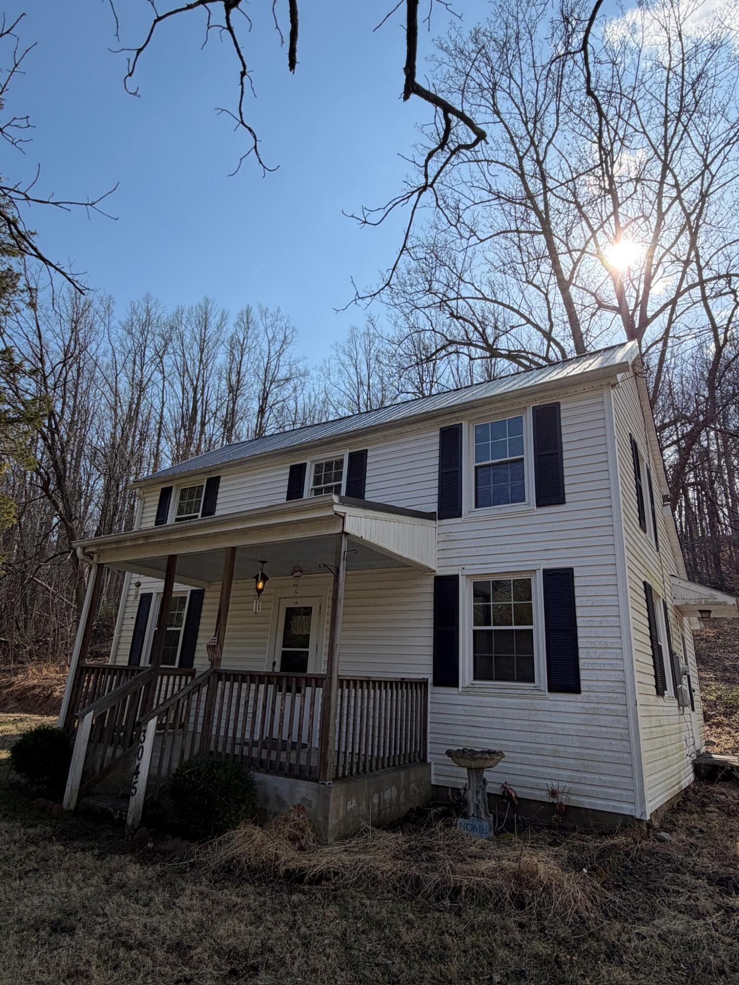 3045 Mountain Pass Road Troutville, VA 24175 - Photo 2 of 19 a front view of a house with a yard