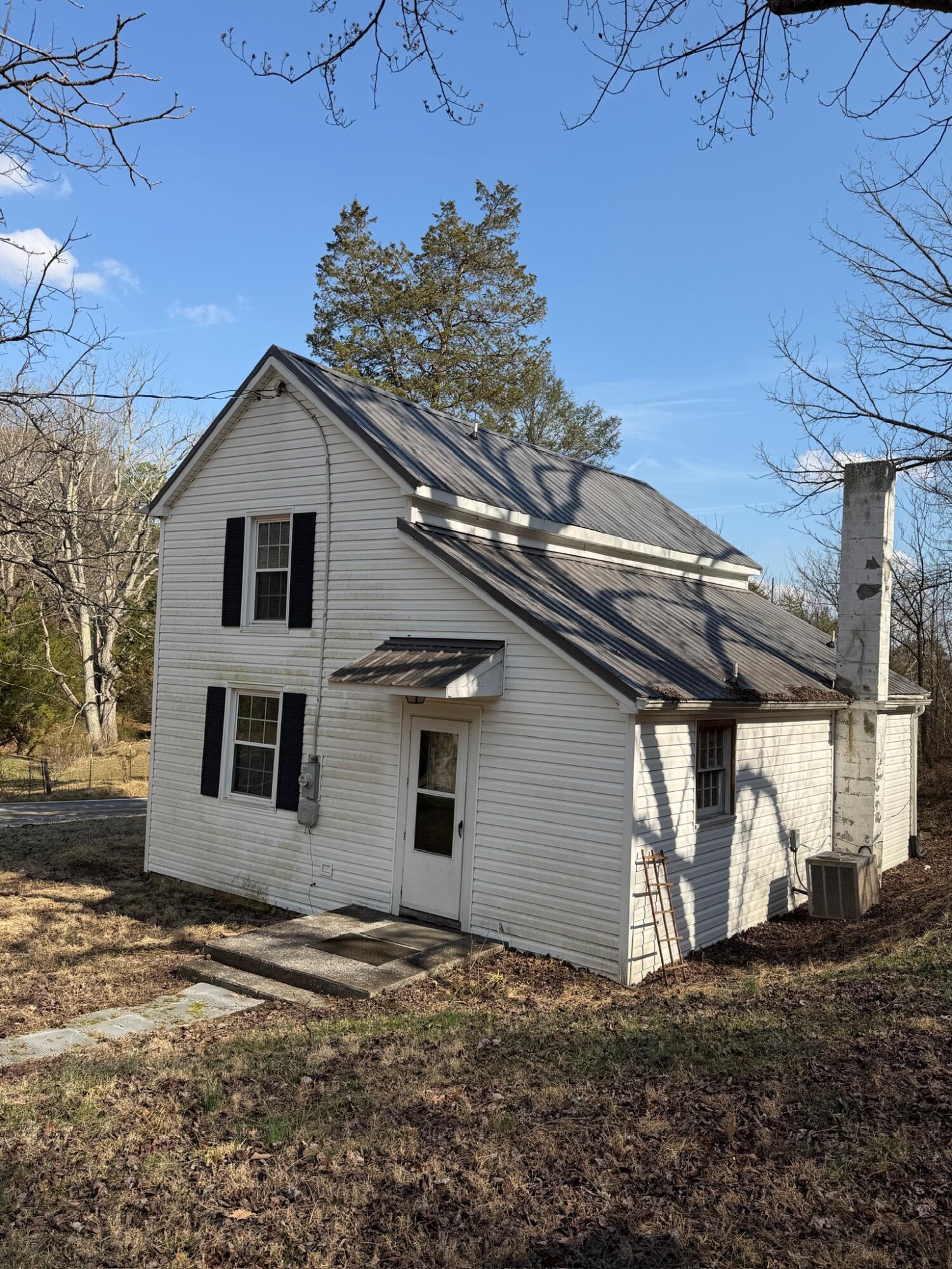 3045 Mountain Pass Road Troutville, VA 24175 - Photo 5 of 19 a view of a grey house with a yard