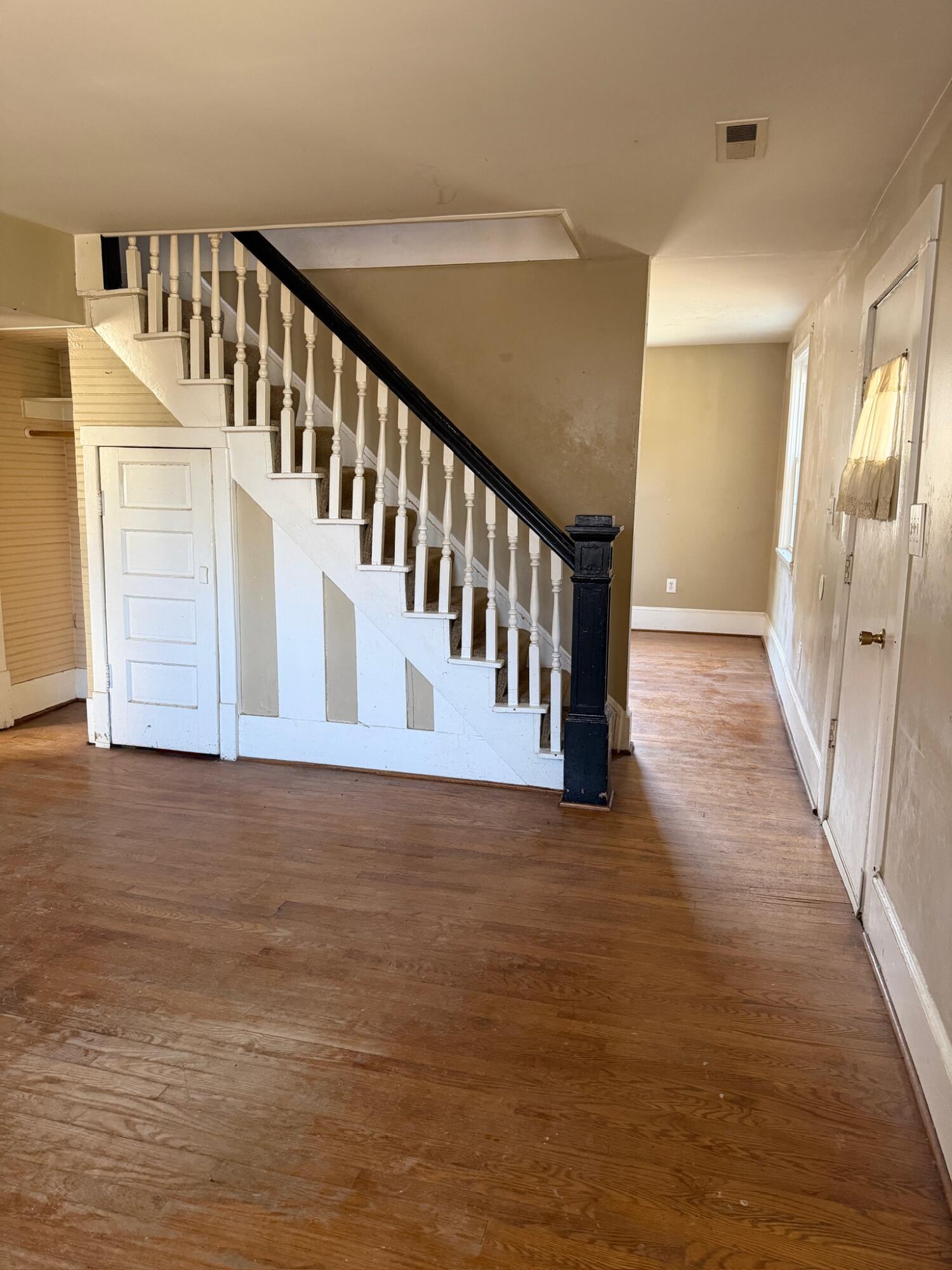 3045 Mountain Pass Road Troutville, VA 24175 - Photo 6 of 19 a view of staircase with white walls and wooden floor
