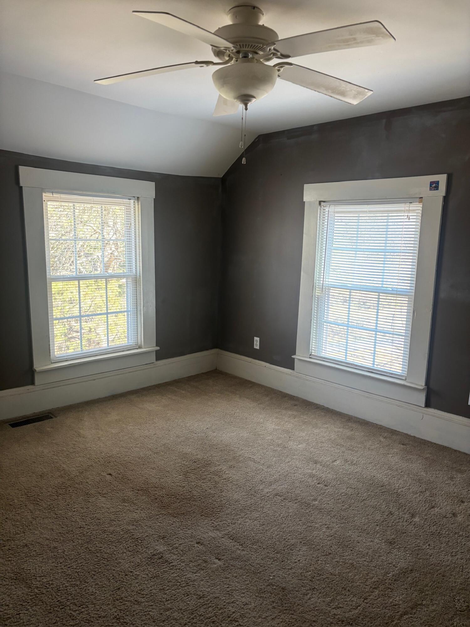 3045 Mountain Pass Road Troutville, VA 24175 - Photo 10 of 19 an empty room with windows and fan