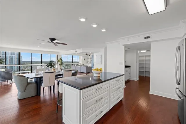 a kitchen with a counter top space a sink and appliances