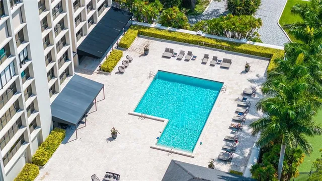 an aerial view of a house with a swimming pool