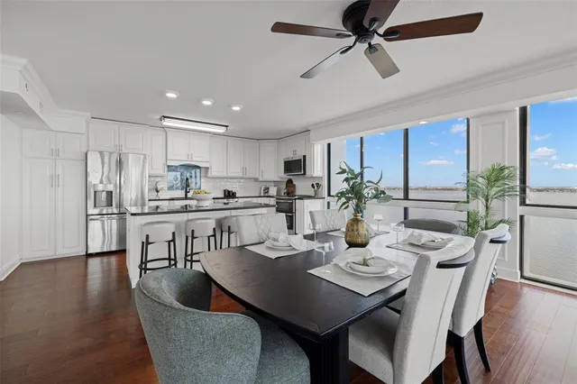 a view of a dining room with furniture and wooden floor