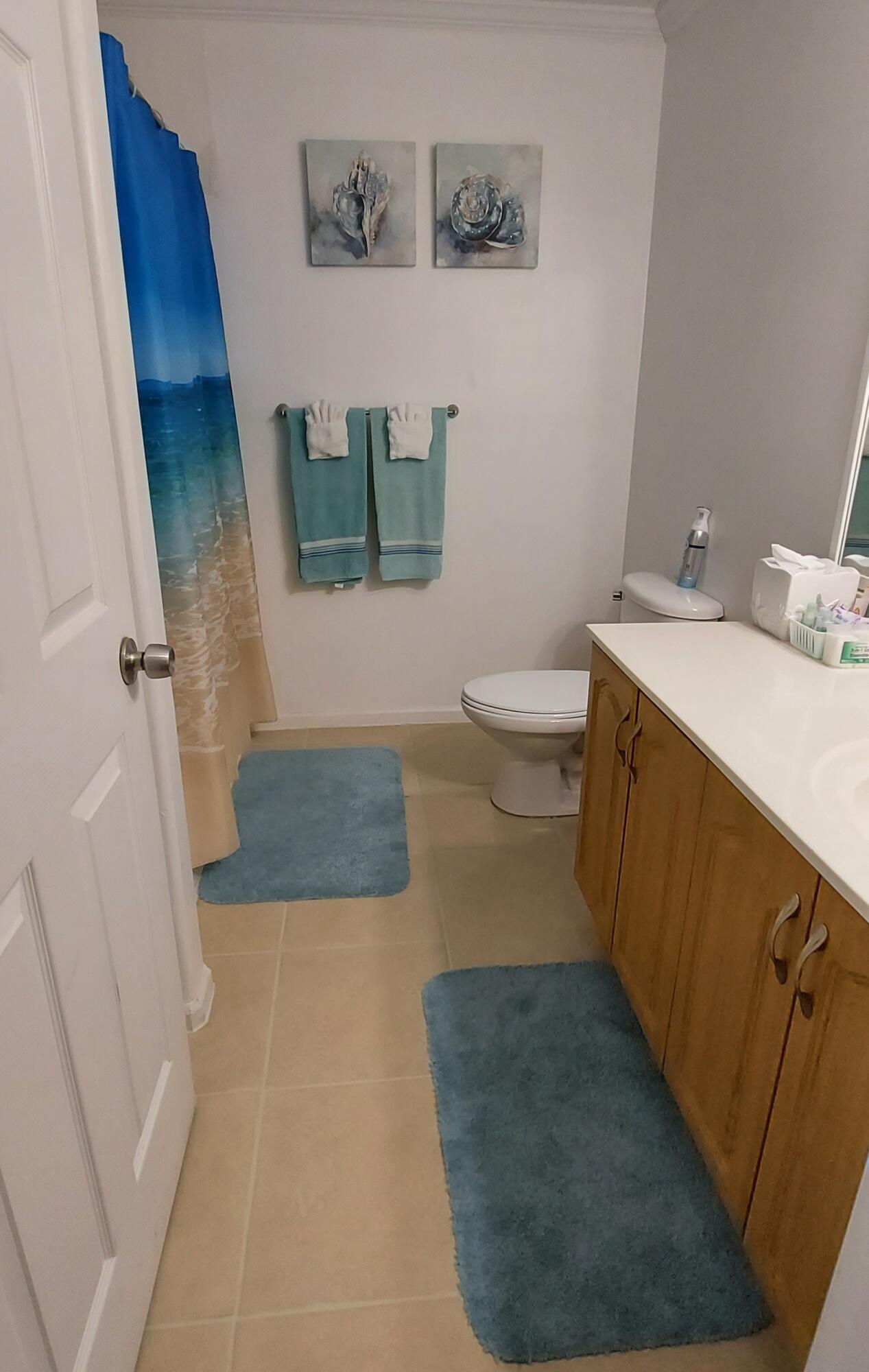 1401 West 9th Street Riviera Beach, FL 33404 - Photo 11 of 17 a bathroom with a sink and toilet