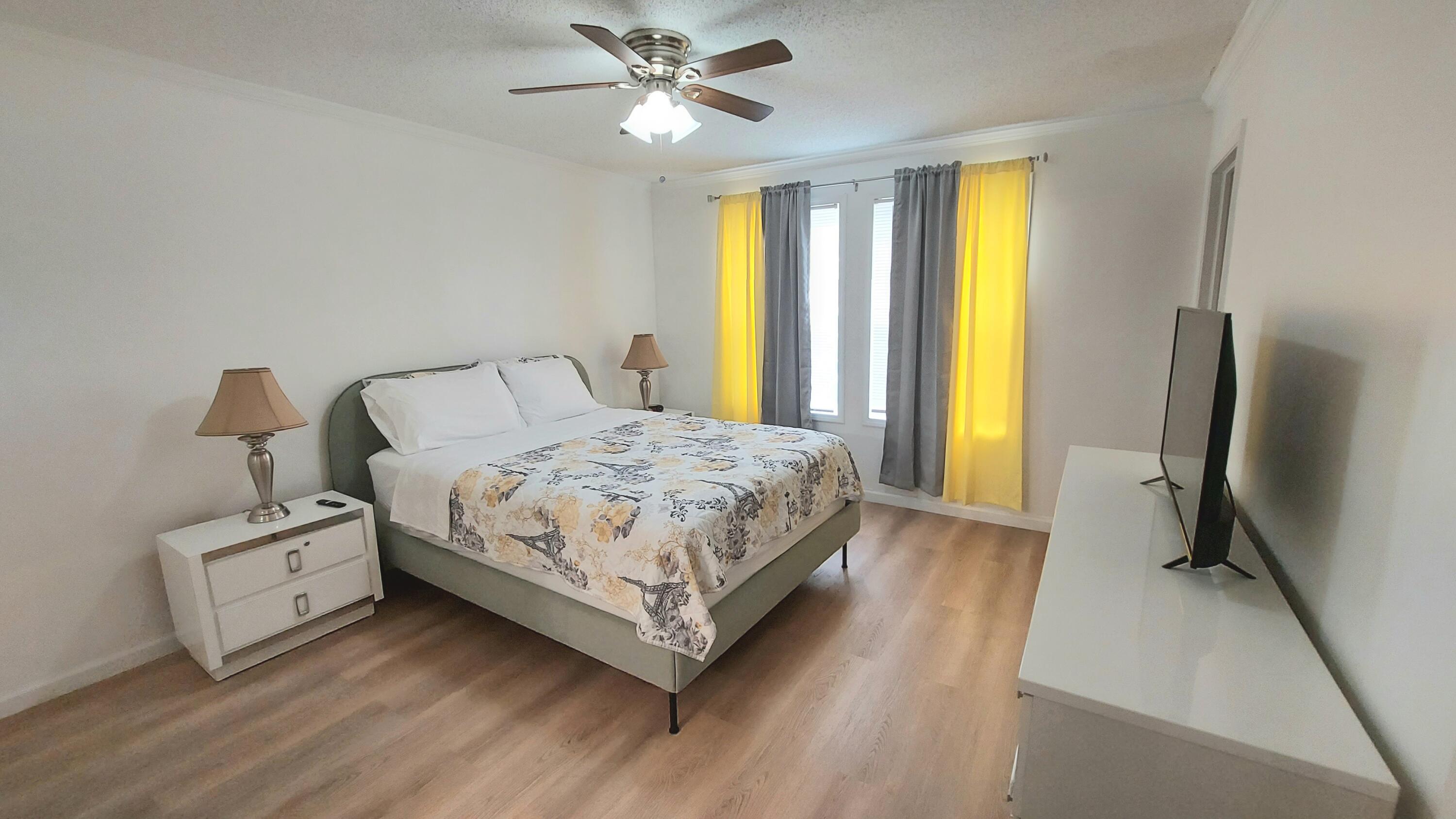 1401 West 9th Street Riviera Beach, FL 33404 - Photo 5 of 17 a bedroom with a bed dresser and a window