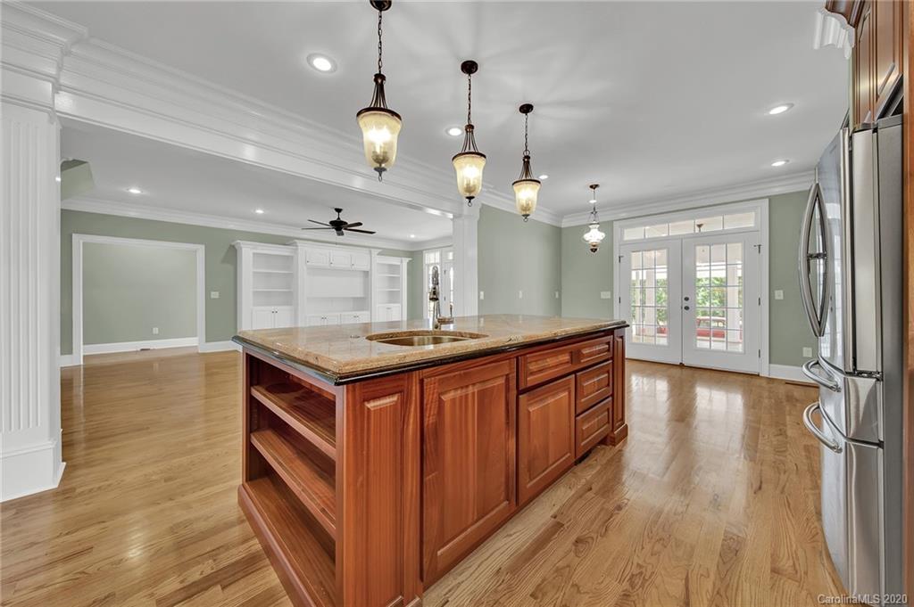 3705 Mining Road Kershaw, SC 29067 - Photo 11 of 47 a kitchen with stainless steel appliances granite countertop a stove and a wooden floors