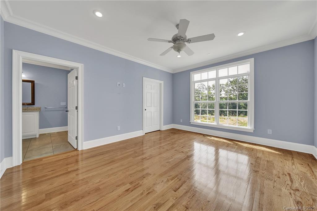 3705 Mining Road Kershaw, SC 29067 - Photo 21 of 47 a view of an empty room with wooden floor and a window