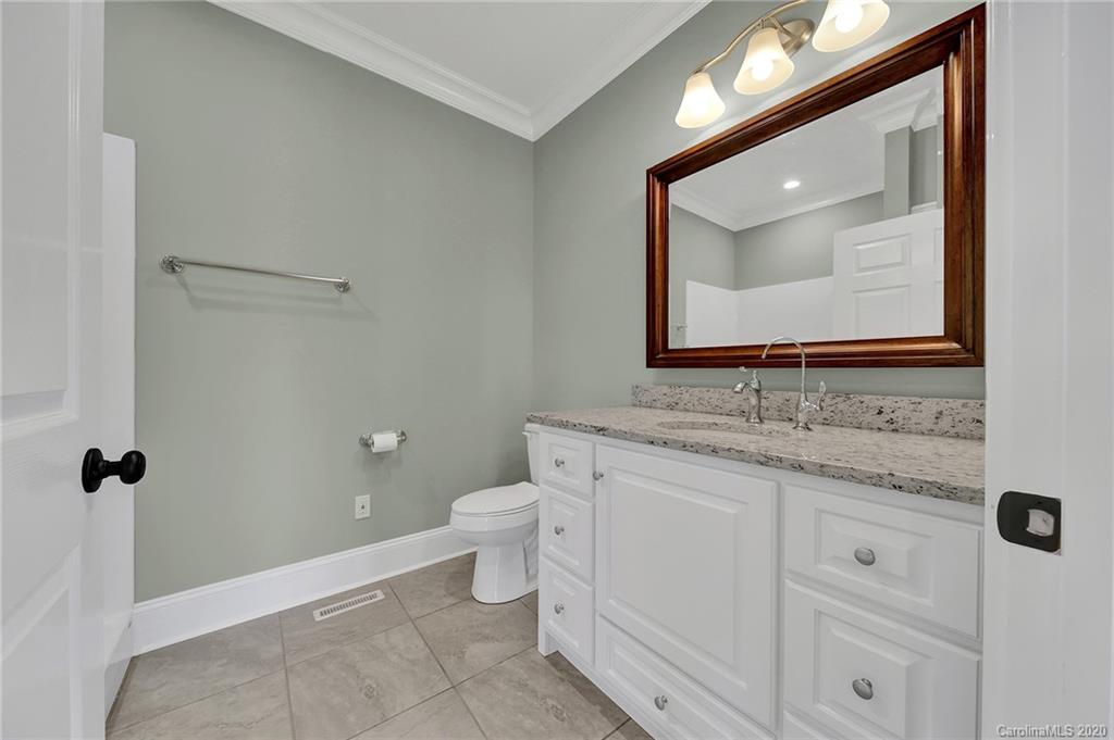 3705 Mining Road Kershaw, SC 29067 - Photo 25 of 47 a bathroom with a toilet sink vanity and mirror