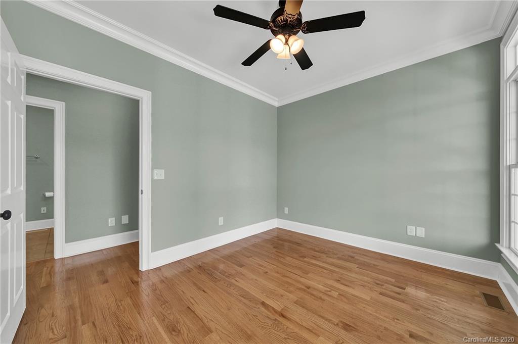 3705 Mining Road Kershaw, SC 29067 - Photo 28 of 47 an empty room with wooden floor and ceiling fan