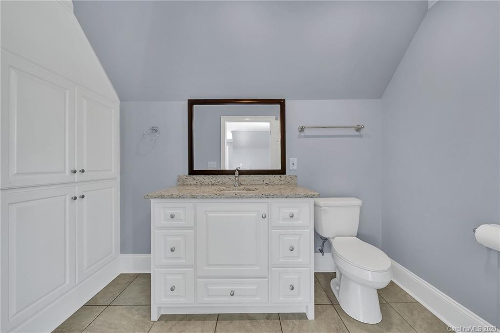3705 Mining Road Kershaw, SC 29067 - Photo 33 of 47 a bathroom with a toilet a sink and mirror