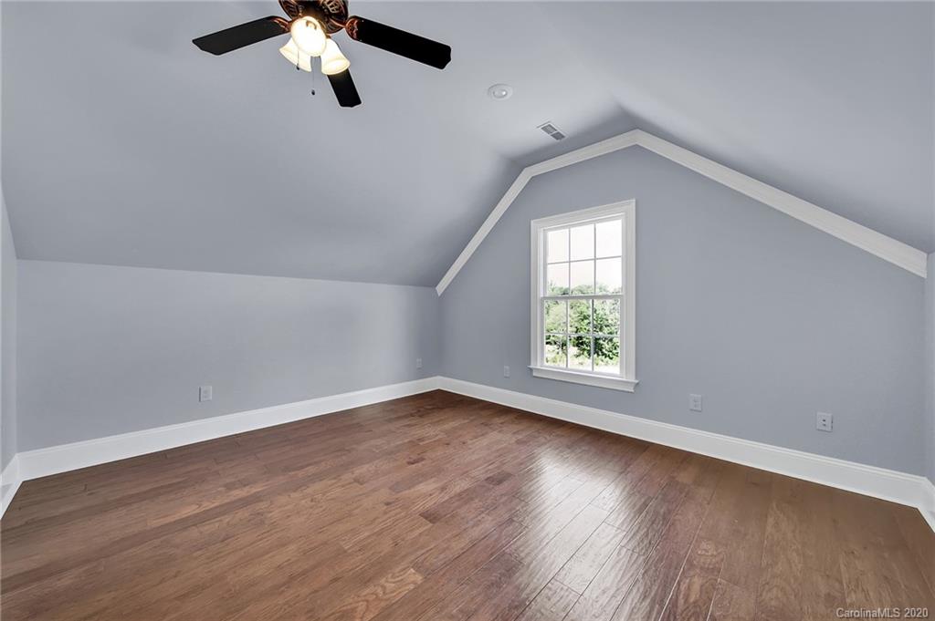 3705 Mining Road Kershaw, SC 29067 - Photo 41 of 47 an empty room with wooden floor cabinet and windows