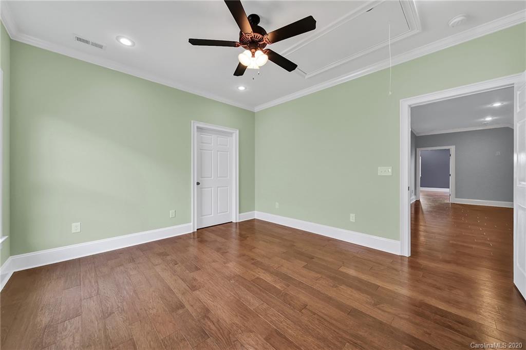 3705 Mining Road Kershaw, SC 29067 - Photo 42 of 47 an empty room with wooden floor and a ceiling fan