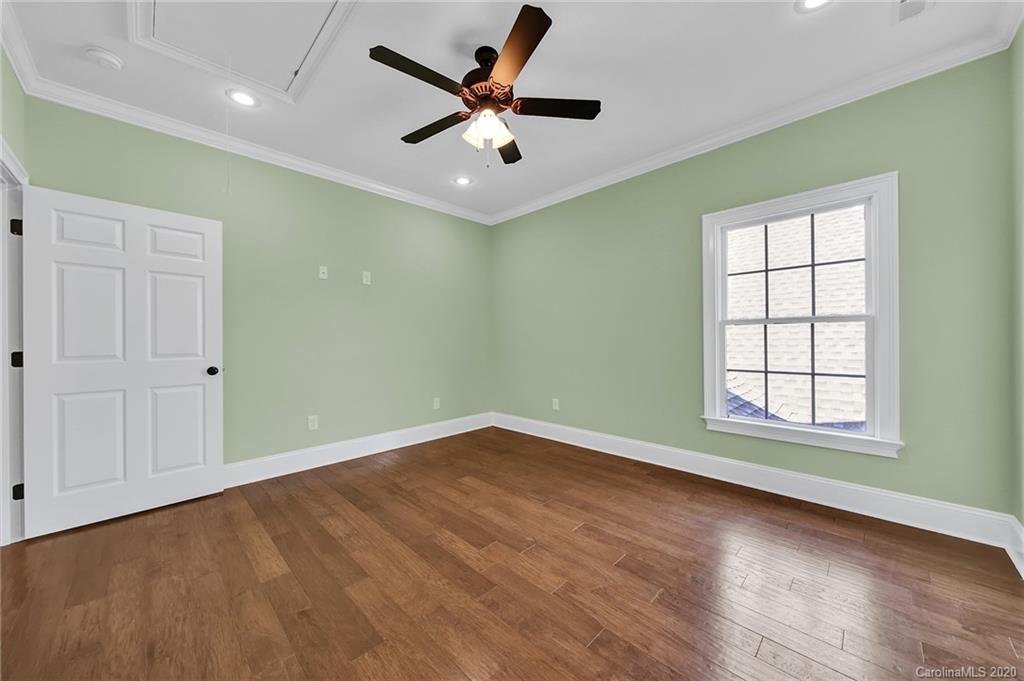 3705 Mining Road Kershaw, SC 29067 - Photo 43 of 47 an empty room with wooden floor ceiling fan and windows