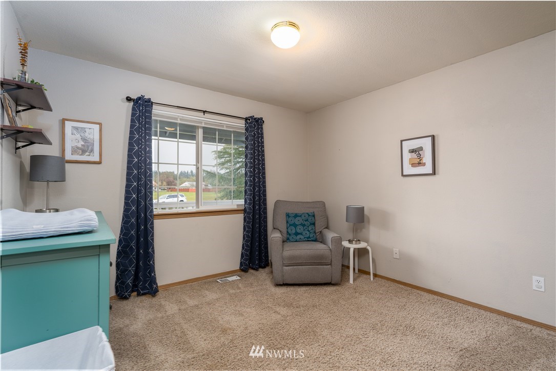 20108 Tahoma Loop Southwest Rochester, WA 98579 - Photo 15 of 27 a living room with furniture and a window