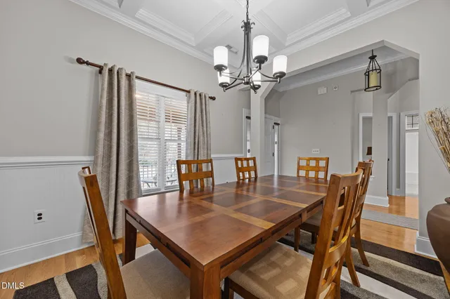 a kitchen with stainless steel appliances kitchen island granite countertop a stove a sink a refrigerator and cabinets