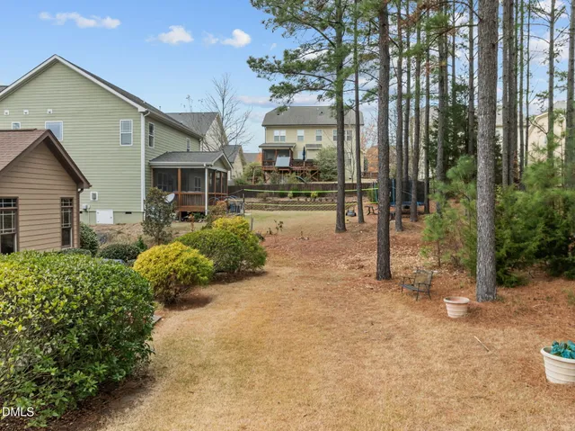 a view of a patio with table and chairs and potted plants