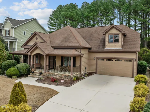 a patio with glass door and outdoor seating