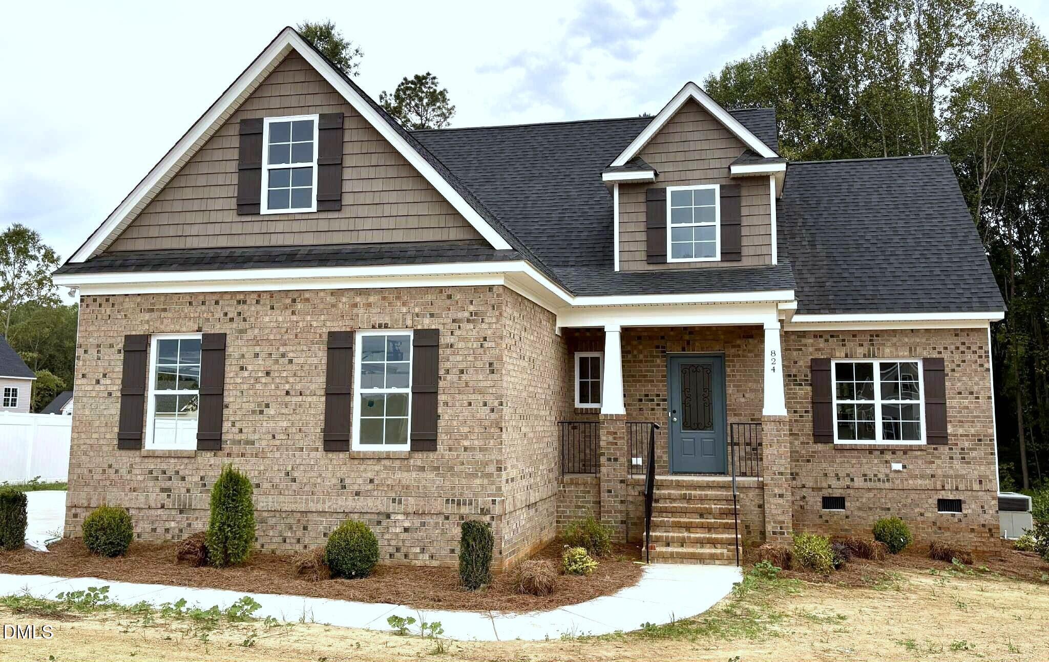 824 Emmett Ct Spring Spring Hope, NC 27882 - Photo 2 of 58 a front view of a house with garden