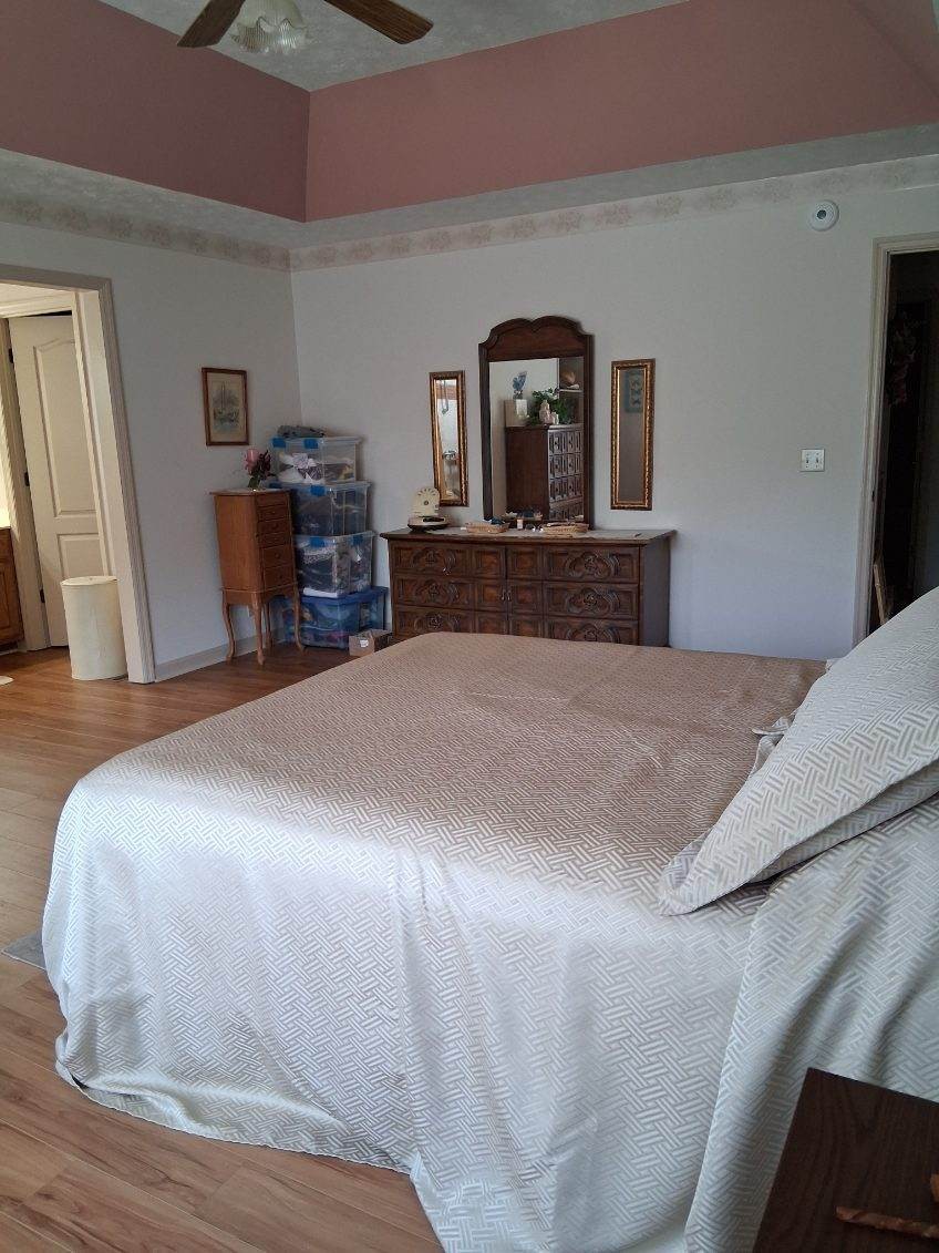3168 Maxey Road Cedar Hill, TN 37032 - Photo 32 of 40 a bedroom with a bed and a television