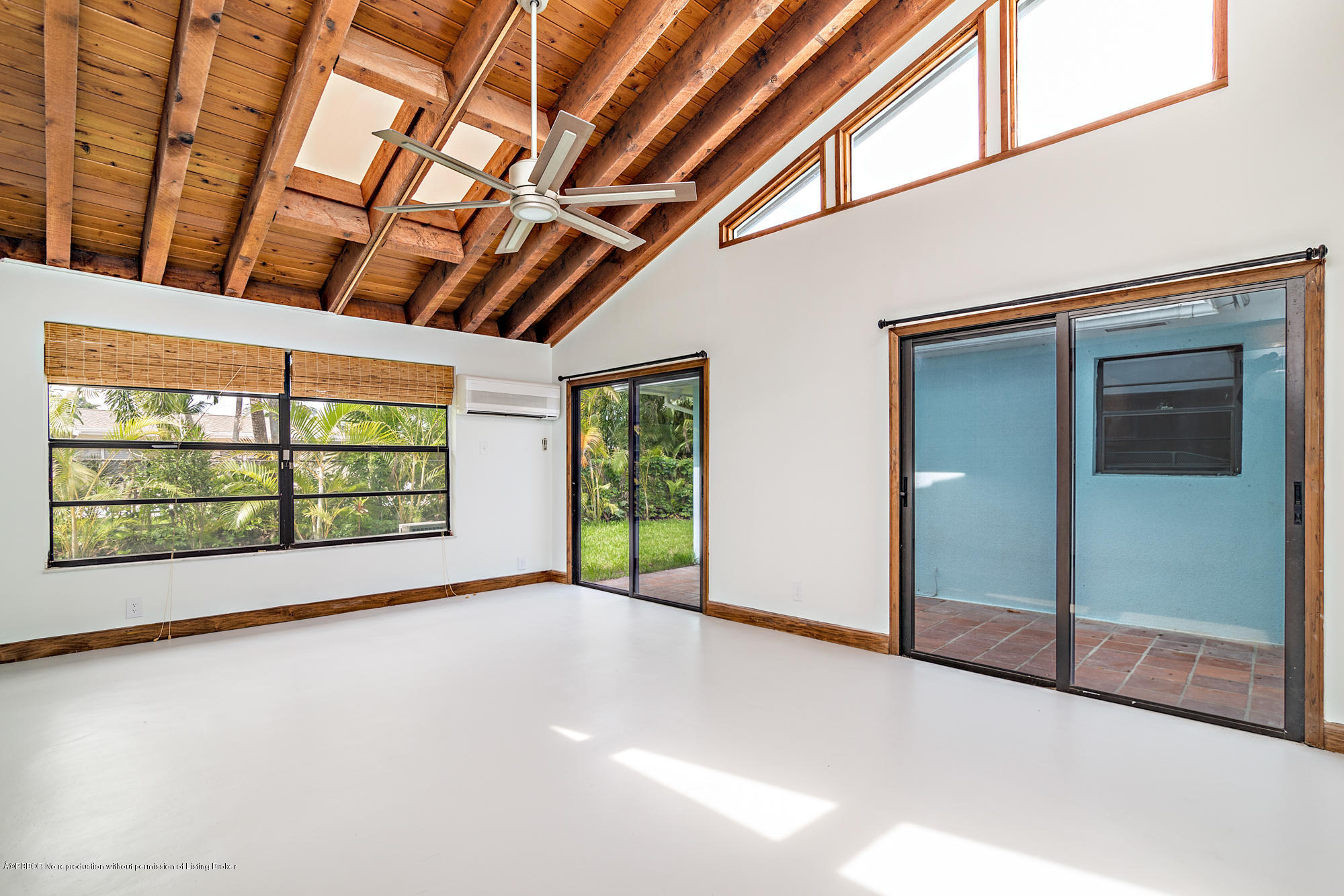 1870 Travis Road West Palm Beach, FL 33406 - Photo 14 of 35 a view of an empty room with a sliding door