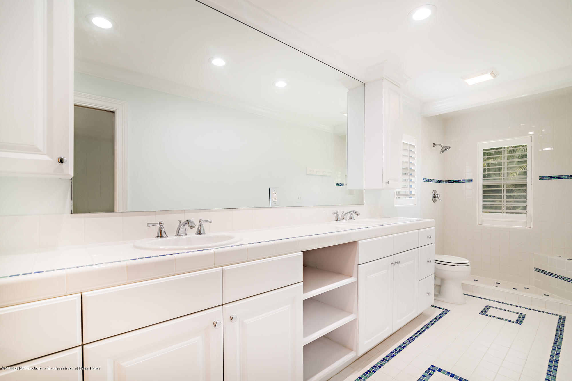 1870 Travis Road West Palm Beach, FL 33406 - Photo 16 of 35 a bathroom with a double vanity sink mirror and toilet