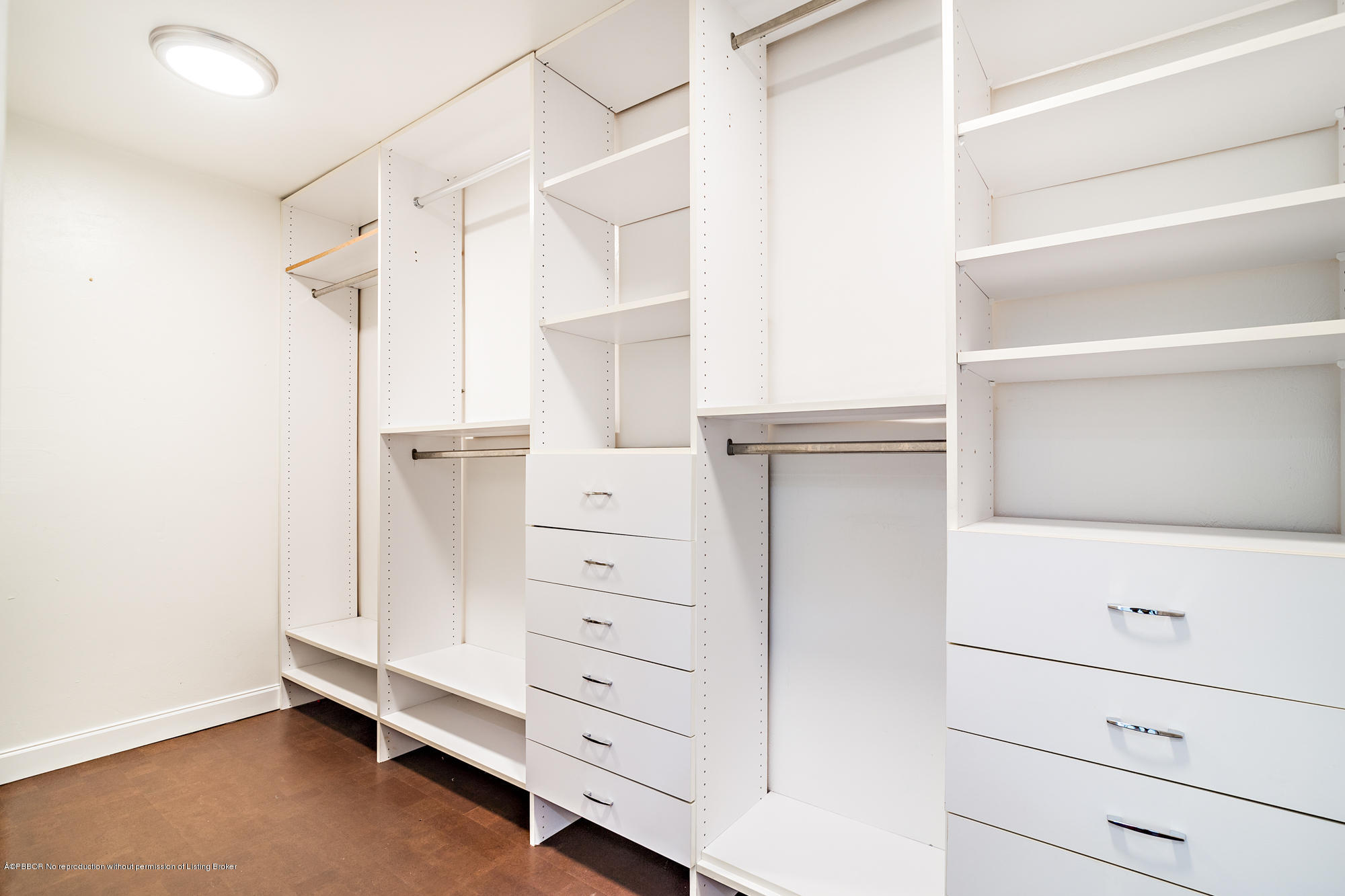 1870 Travis Road West Palm Beach, FL 33406 - Photo 17 of 35 a view of walk in closet with cabinet