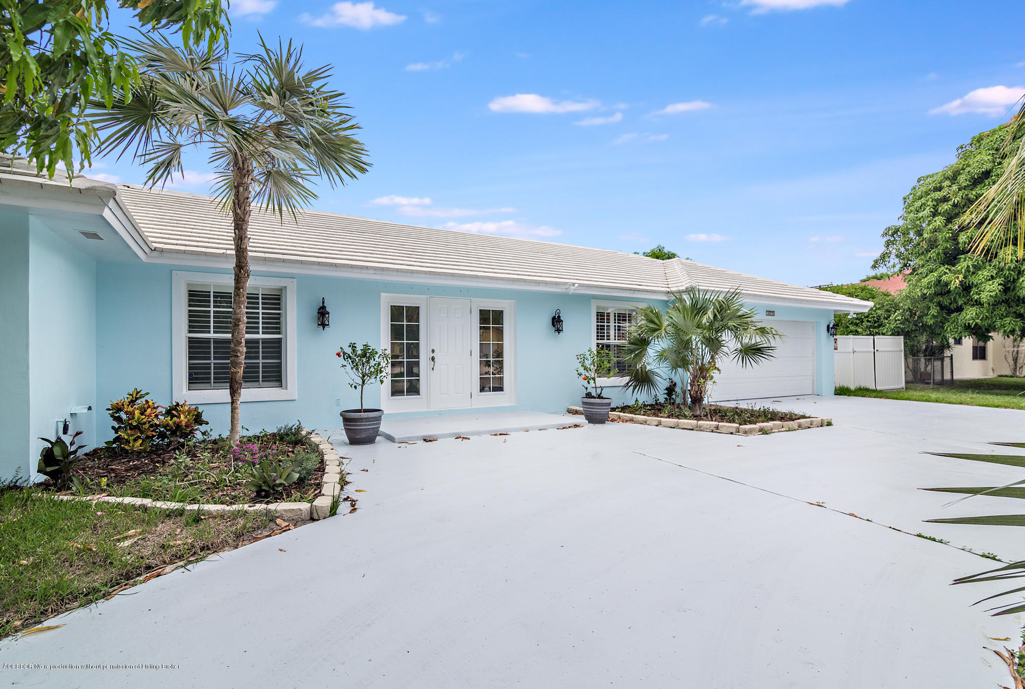 1870 Travis Road West Palm Beach, FL 33406 - Photo 3 of 35 a front view of a house with porch and seating space