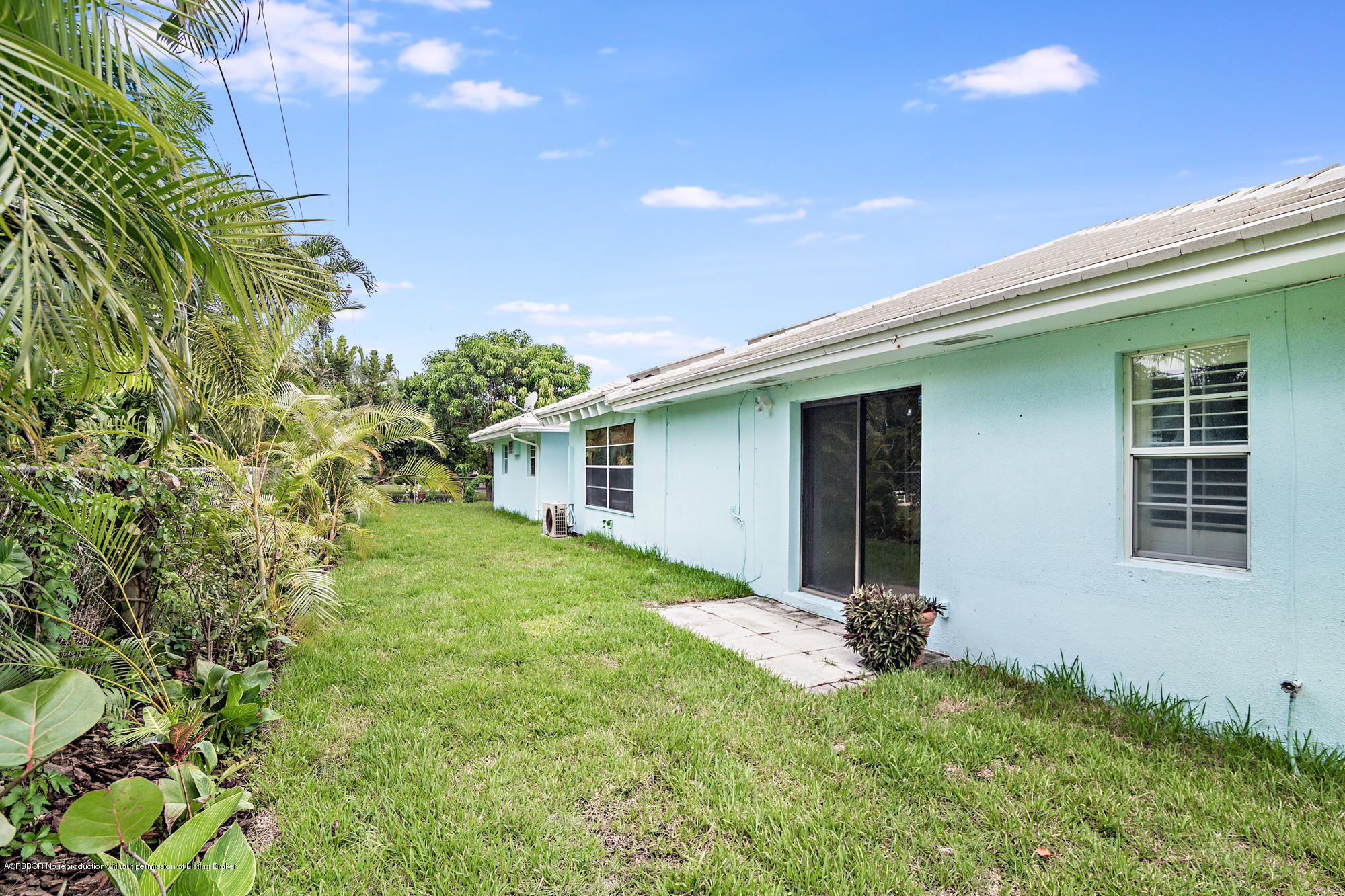 1870 Travis Road West Palm Beach, FL 33406 - Photo 26 of 35 front view of a house with a yard