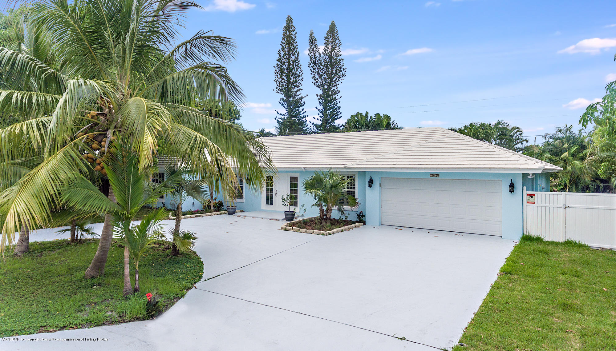 1870 Travis Road West Palm Beach, FL 33406 - Photo 27 of 35 a row of palm trees in front of house