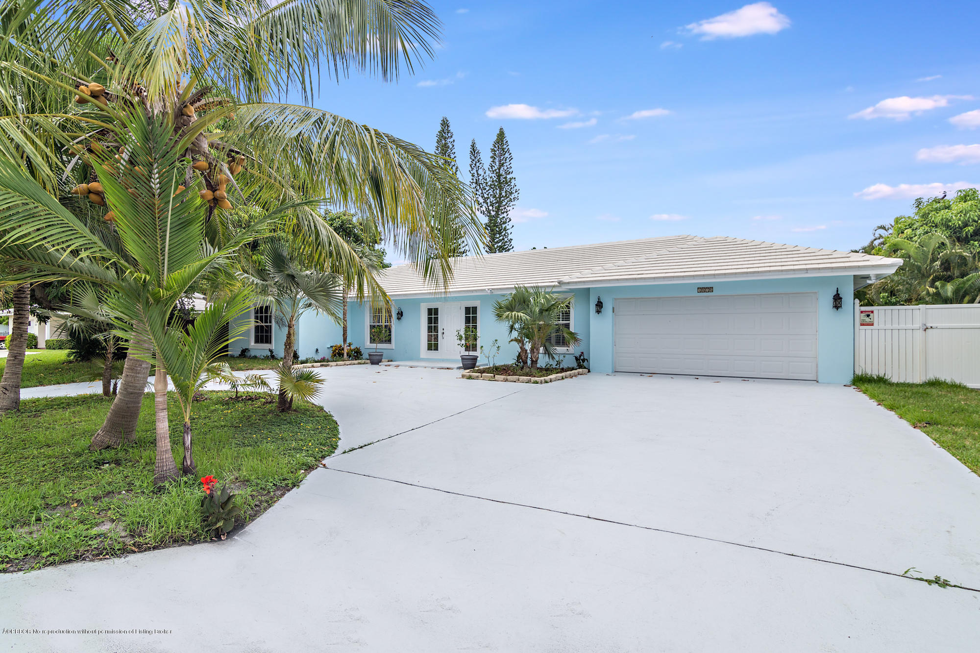 1870 Travis Road West Palm Beach, FL 33406 - Photo 4 of 35 a front view of a house with a garden