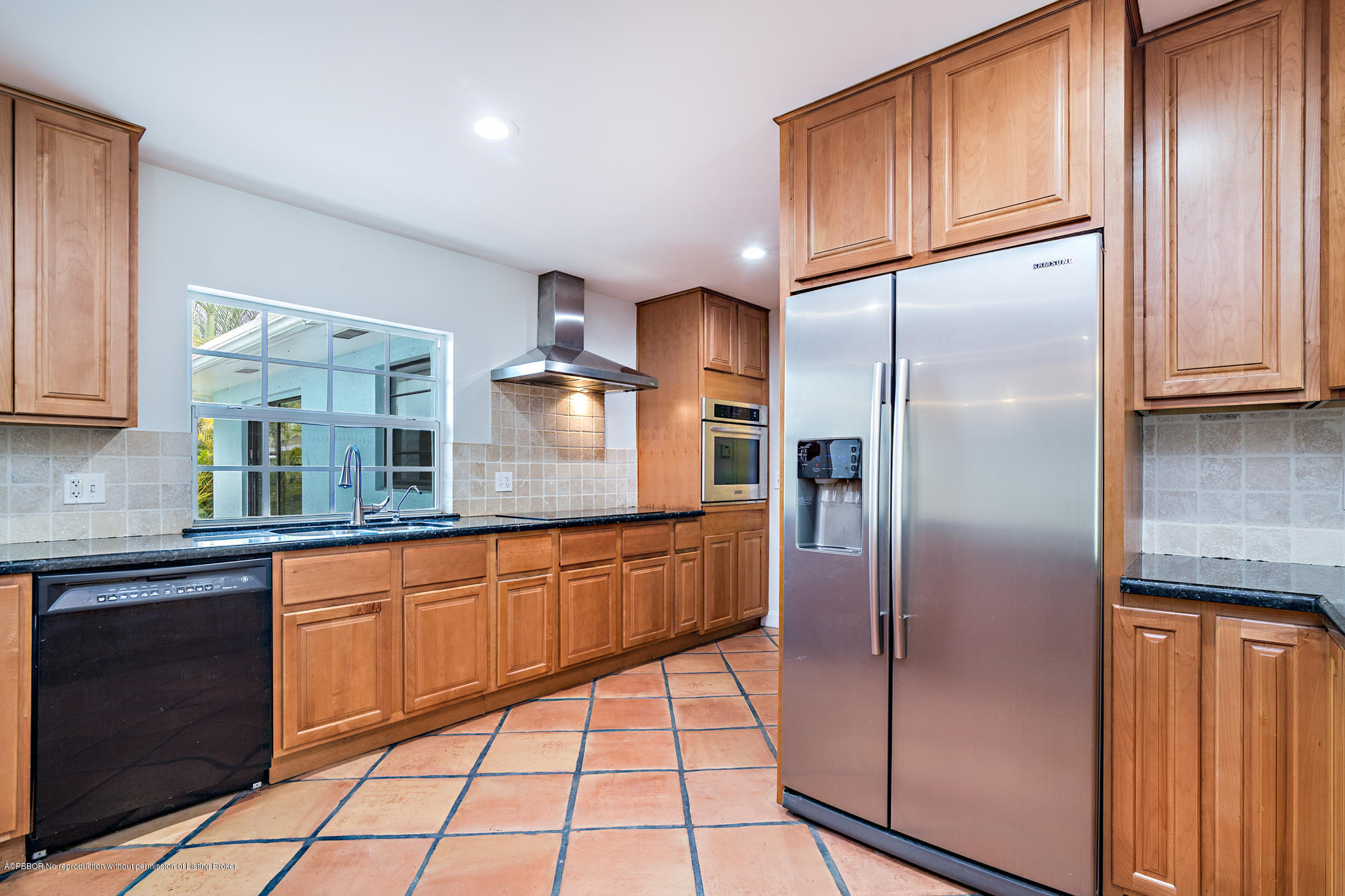 1870 Travis Road West Palm Beach, FL 33406 - Photo 6 of 35 a kitchen with stainless steel appliances granite countertop a refrigerator and a sink