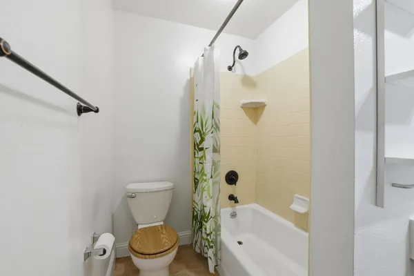 a view of an empty room and a window