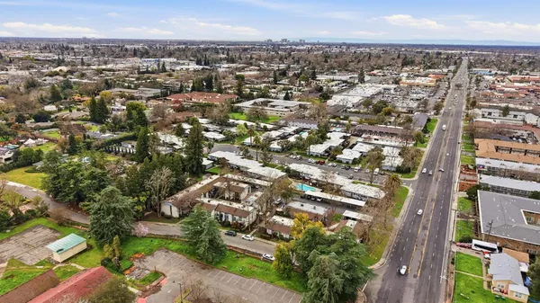 an aerial view of a house with a swimming pool