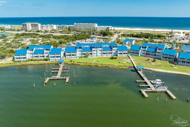 a view of a swimming pool with lawn chairs