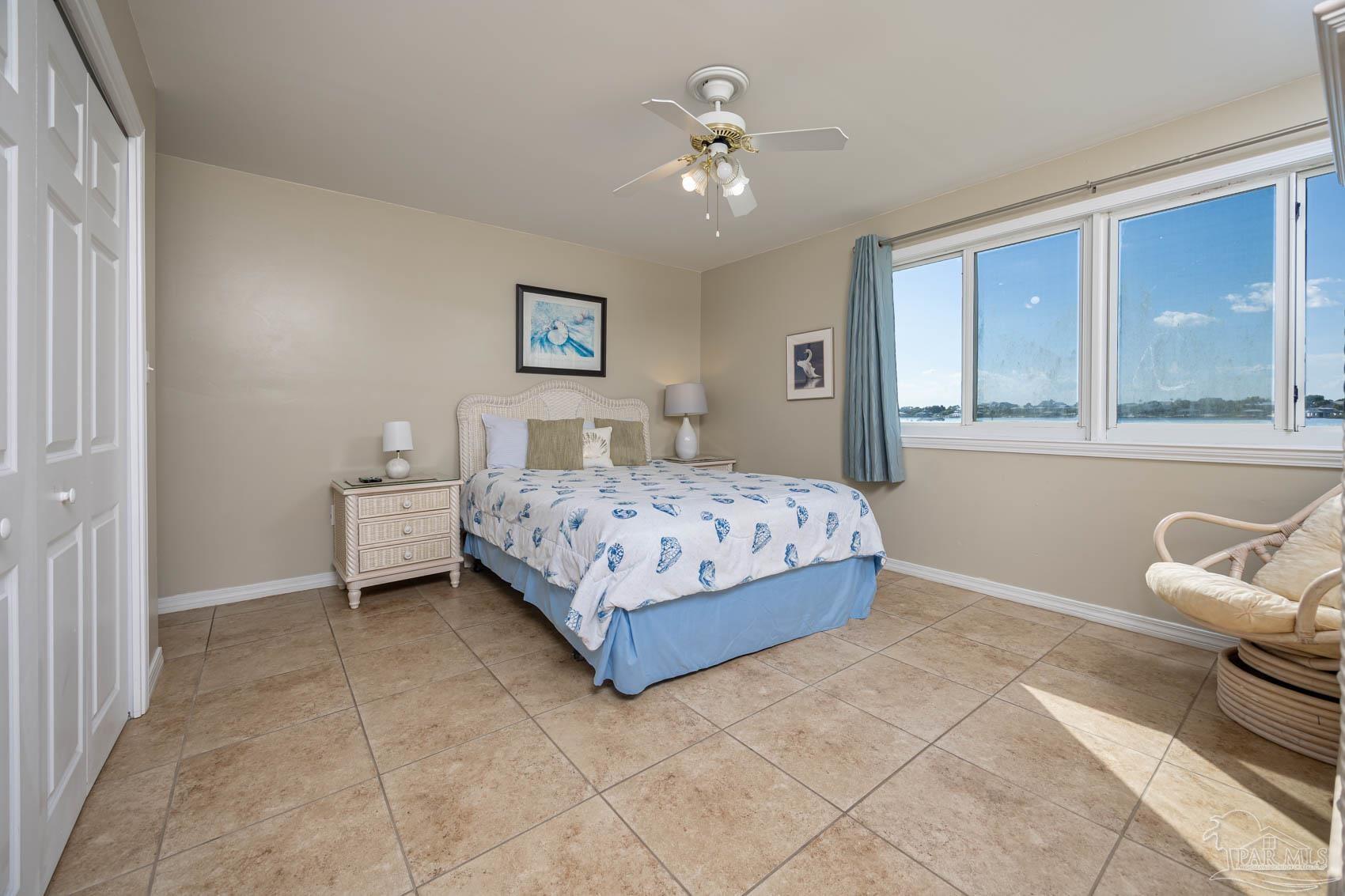 16470 Perdido Key Drive, Unit B13 Perdido Key, FL 32507 - Photo 19 of 30 a bedroom with a bed couch and window