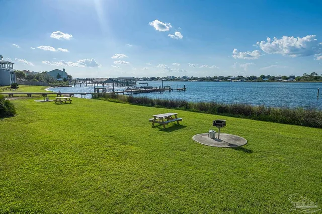 a view of a lake with a big yard