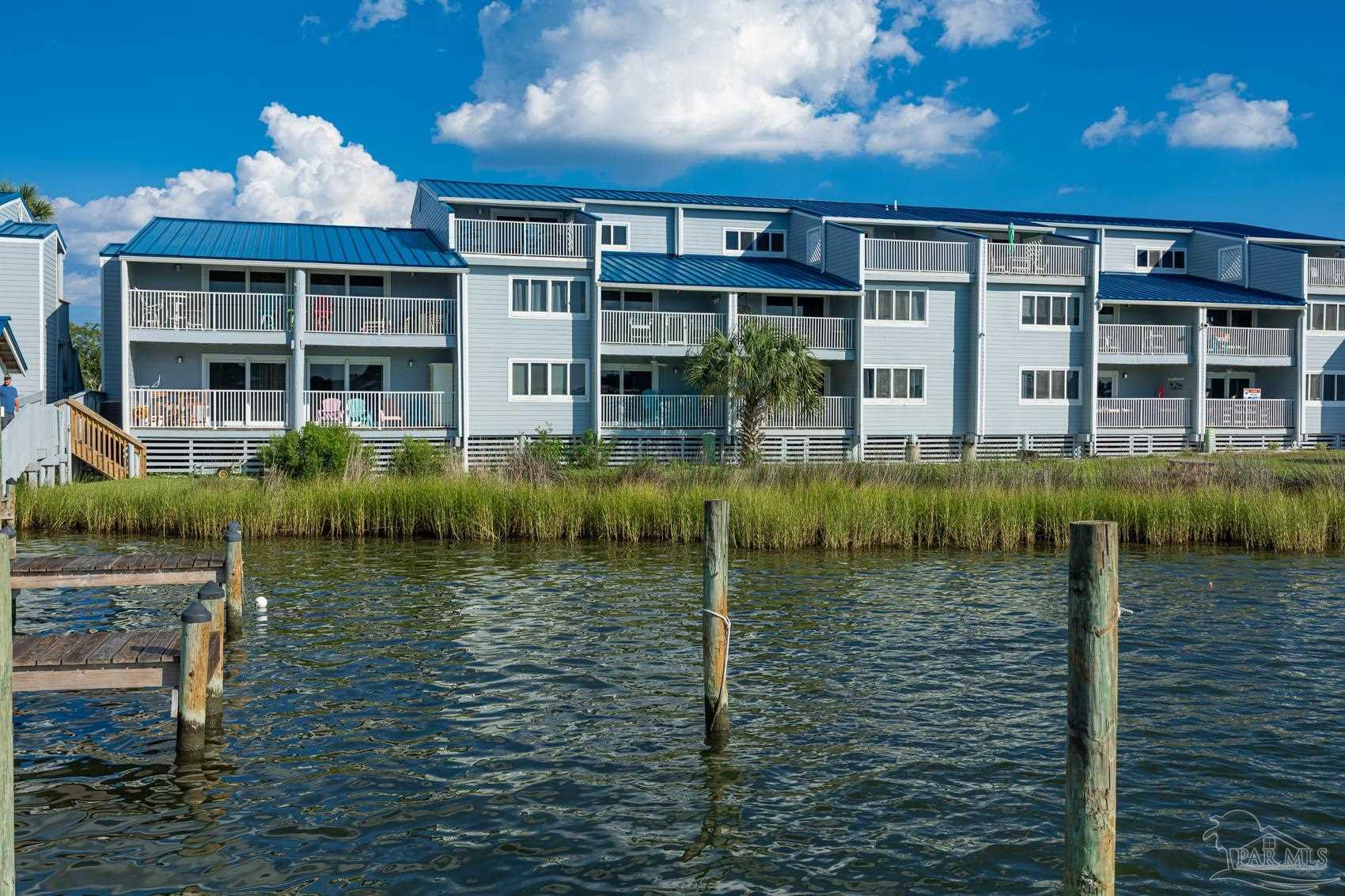 16470 Perdido Key Drive, Unit B13 Perdido Key, FL 32507 - Photo 28 of 30 a front view of a house with a yard
