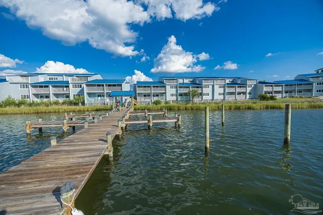 a view of a swimming pool with an outdoor seating