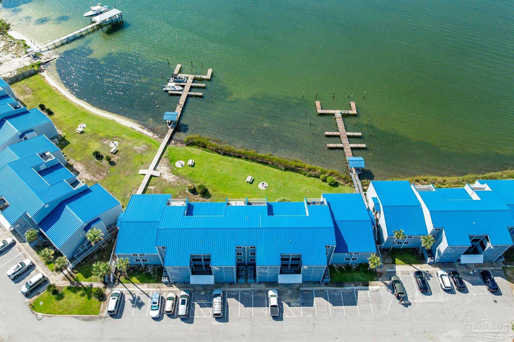 16470 Perdido Key Drive, Unit B13 Perdido Key, FL 32507 - Photo 4 of 30 a view of a patio with table and chairs