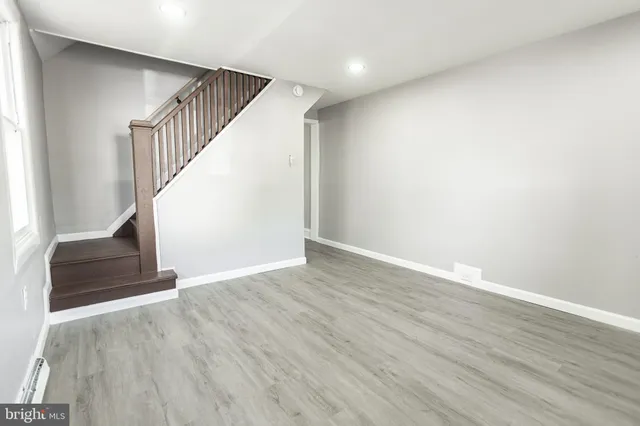 a view of entryway with wooden floor
