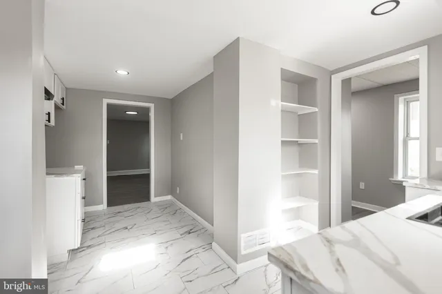 a bedroom with a bed and a view of bathroom