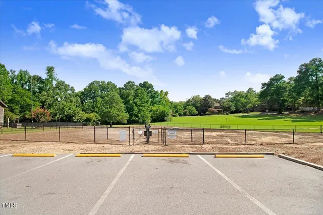 a view of a swimming pool with a yard
