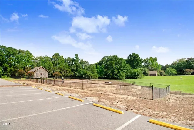 a view of a lake with houses in the back