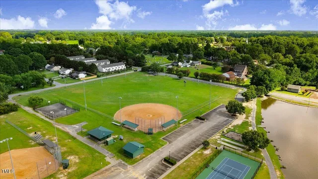 a view of a swimming pool with a yard
