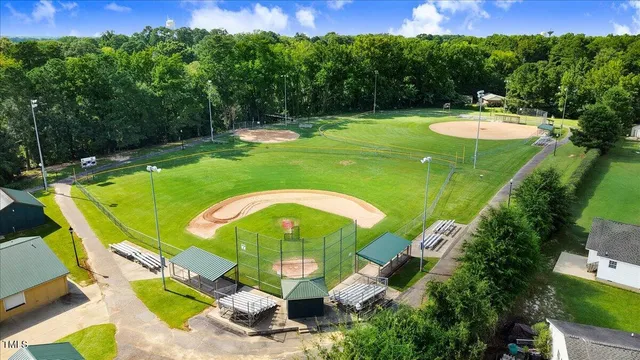 a view of swimming pool with a yard